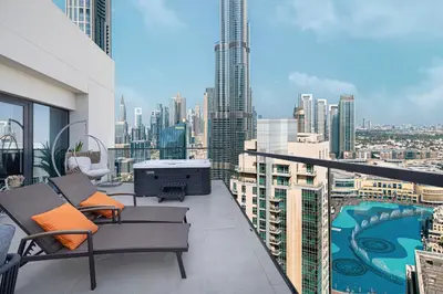 a balcony with a view of a city at Luxury Downtown 2 Bedroom Apartment with amazing Burj and Fountain Views and Private Jacuzzi on a large Terrace in Dubai