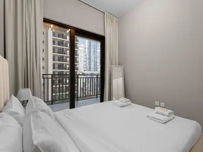 a bedroom with a white bed and a large window at Zada Glam Sleek 1BDR Retreat-Business Bay-25 in Dubai