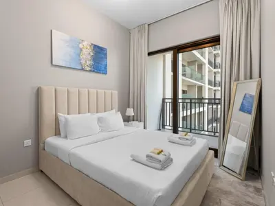 a bedroom with a large bed and a balcony at Zada Glam Sleek 1BDR Retreat-Business Bay-25 in Dubai