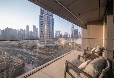 a balcony with a view of a city from a building at Luxury 2 Bed in Boulevard Point with City Views in Dubai