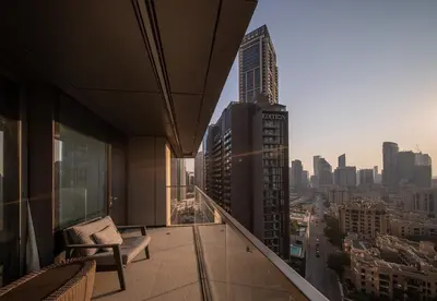 an apartment balcony with a view of a city at Luxury 2 Bed in Boulevard Point with City Views in Dubai