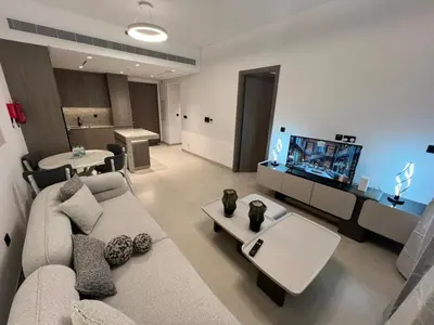 a living room with a couch and a flat screen tv at Amazing Dubai Silicon Oasis Rental Apartments in Dubai