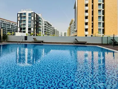 a large swimming pool on the roof of a building at Premium Guest - Dubai Riviera in Dubai