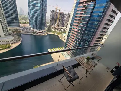 a balcony with chairs and a view of a river at Click Stay - JLT - Entire Studio & Balcony Lakes view Apartment -HW in Dubai