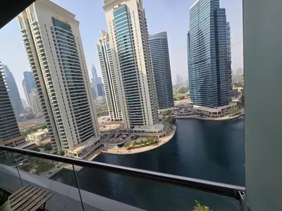 a view of a city with tall buildings and a river at Click Stay - JLT - Entire Studio & Balcony Lakes view Apartment -HW in Dubai
