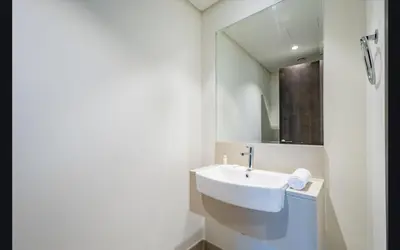 a bathroom with a sink and a mirror at Luxury 1025 sq feet 1 bed apartment in 29 floor Dubai Creek Residences in Dubai