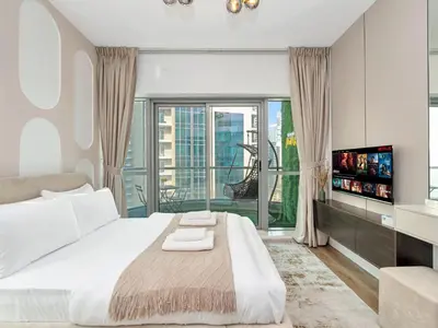 a bedroom with a large bed and a large window at Luxury Waterfront View w Ain Dubai and PS5 in JBR 5 min from the beach in Dubai