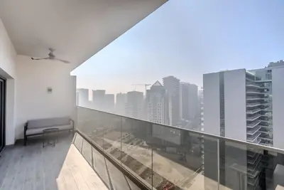 a balcony with a view of a city at TRPS - MAG 318, Business Bay - Spacious 1BR plus Maids, Furnished, City View in Dubai