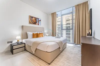 a bedroom with a large bed and a large window at Glimpse of Burj Khalifa 2BR, 15-Minute Drive to Burj Khalifa and Downtown Landmarks, District One Phase III Residences 13, Mohammed Bin Rashid Al Maktoum City by Deluxe Holiday Homes in Dubai