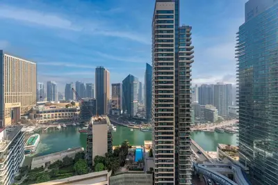 a view of a city with a river and buildings at GuestReady | 2BR | Stunning Canal View, JBR in Dubai