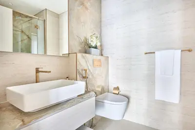 a bathroom with a sink and a toilet at Frank Porter - Pearl House in Dubai