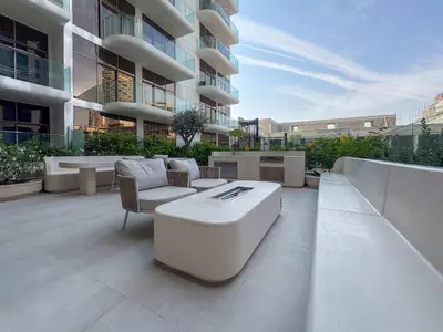 a patio with couches and chairs on a building at Frank Porter - Pearl House in Dubai