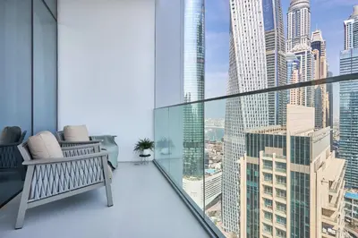 a balcony with a bench and a view of a city at Frank Porter - Liv Marina in Dubai