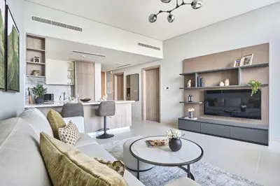 a living room with a couch and a table at Frank Porter - Liv Marina in Dubai