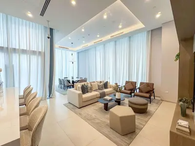 a living room with a couch and chairs and a table at Frank Porter - Liv Marina in Dubai