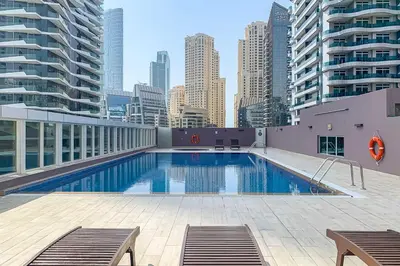 a swimming pool on the roof of a building at Frank Porter - Westside Marina in Dubai