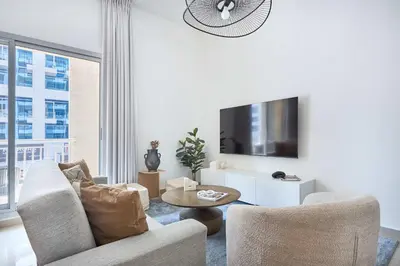 a living room with a couch and a table at Frank Porter - Westside Marina in Dubai