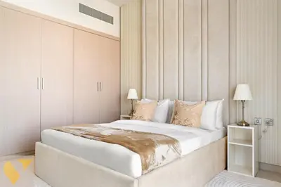 a bedroom with a large white bed in a room at Vogue JVC Jeewar Tower Near Circle Mall, One Bedroom Apartment with Balcony and City View, Access to all Amenities in Dubai