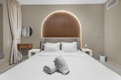 a bedroom with a bed with towels on it at Exclusive 2BR I Panoramic Views I Downtown Dubai in Dubai