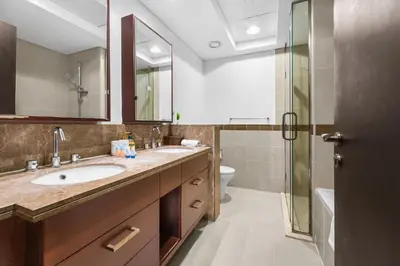 a bathroom with a sink and a shower at Exclusive 2BR I Panoramic Views I Downtown Dubai in Dubai