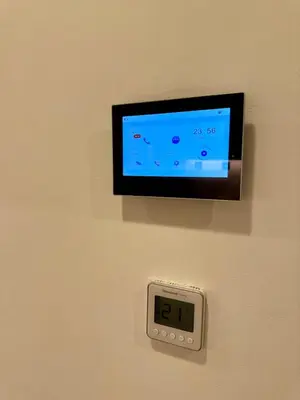 an alarm clock on a wall with a clock on it at Azizi Riviera Studio High Floor Partial Burj View in Dubai