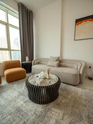a living room with a couch and a coffee table at Wonderful 2bd with full marina view HIGH FLOOR in Dubai