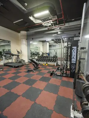a gym with several treadmills and exercise bikes at Wonderful 2bd with full marina view HIGH FLOOR in Dubai