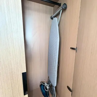 a mirror hanging on a door with a pair of shoes at A place like home for relaxation in Dubai