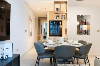 a dining room with a table and chairs at 2BR Vida Dubai Mall Tower 2 Direct Mall Access in Dubai