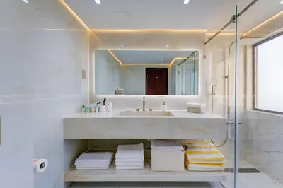 a bathroom with a sink and a mirror at 2 Bedroom Apartment, JBR Beach with Dubai Eye View in Dubai
