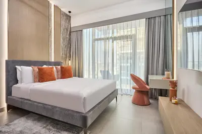 a bedroom with a bed and a large window at Elegant Luxury Studio 12th Floor Sky high View in Dubai