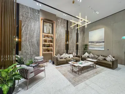 a living room with a couch and a table at Elegant Luxury Studio 12th Floor Sky high View in Dubai
