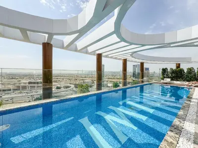 a swimming pool on top of a building at Elegant Luxury Studio 12th Floor Sky high View in Dubai