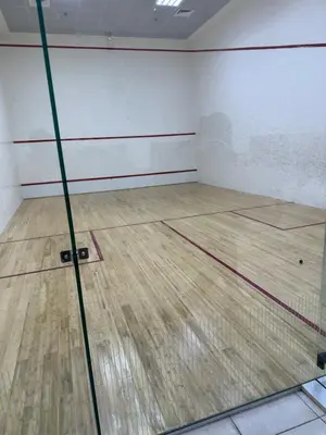 an empty room with a basketball court with a wooden floor at Fantastic 1 bed apt near Marina & Jumeira Beach in Dubai