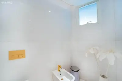a white bathroom with a urinal and a window at FIVE Palm-Private Pool and Garden-Luxury Suite in Dubai