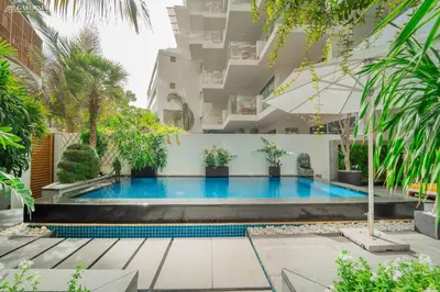a swimming pool in front of a building at FIVE Palm-Private Pool and Garden-Luxury Suite in Dubai