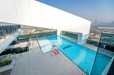 a swimming pool on top of a building at 1-Bedroom Apartment near Dubai Frame High Floor in Dubai
