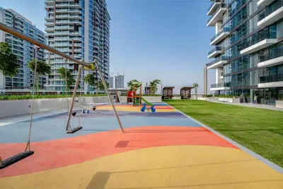 a playground in the middle of a city with tall buildings at 1-Bedroom Apartment near Dubai Frame High Floor in Dubai