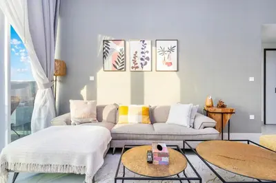a living room with a couch and a table at 1-Bedroom Apartment near Dubai Frame High Floor in Dubai
