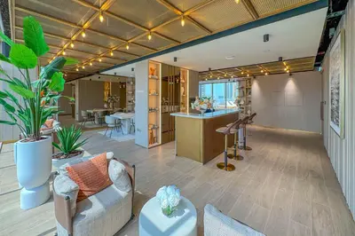 a large room with a couch and a table at Pearl House I JVC- 5 Star Facilities- Magnificent Apartment in Dubai