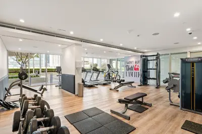 a gym with several treadmills and cardio machines at Burj Khalifa&City View 1BR, Near Dubai Water Canal, Vera Tower, Business Bay by Morada Holidays in Dubai