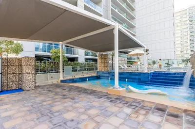 a swimming pool in a building with a fountain at Burj Khalifa&City View 1BR, Near Dubai Water Canal, Vera Tower, Business Bay by Morada Holidays in Dubai