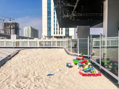a sandpit with toys in the middle of a building at Gemz by Danube with Private Pool - Onelink in Dubai