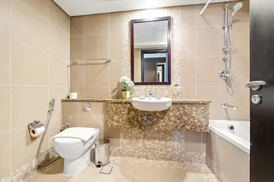 a bathroom with a toilet and a sink at Silkhaus Deluxe 1BR Stay in Sky gardens in DIFC in Dubai