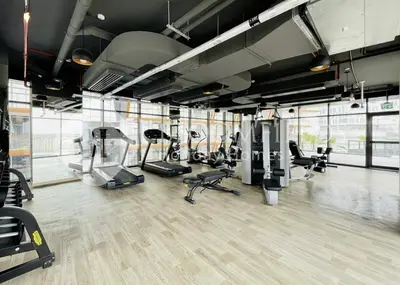 a gym with several treadmills and cardio machines at 202-Bloomfields Iconic 1br Binghatti Avenue in Dubai
