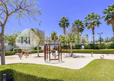 a playground with children playing in a park at 202-Bloomfields Iconic 1br Binghatti Avenue in Dubai