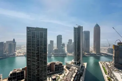 a view of a city with skyscrapers and a body of water at GuestReady - 2BR l Stunning Canal View in Dubai