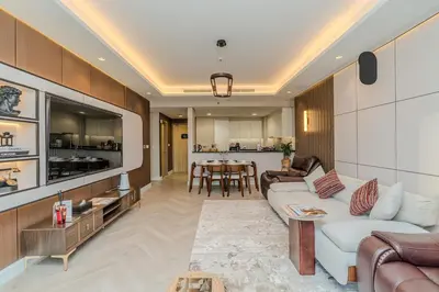a living room with a couch and a table at Paramount Midtown Luxury 2BR Sleeps 7 Near Business Bay Metro and Dubai Mall in Dubai
