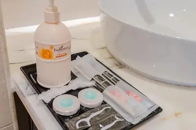 a plastic tray with a bottle of milk and other items at Paramount Midtown Luxury 2BR Sleeps 7 Near Business Bay Metro and Dubai Mall in Dubai