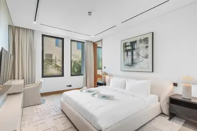 a bedroom with a large white bed in a room at Premium 4 BR Villa in Palm Jumeirah with Private Pool in Dubai